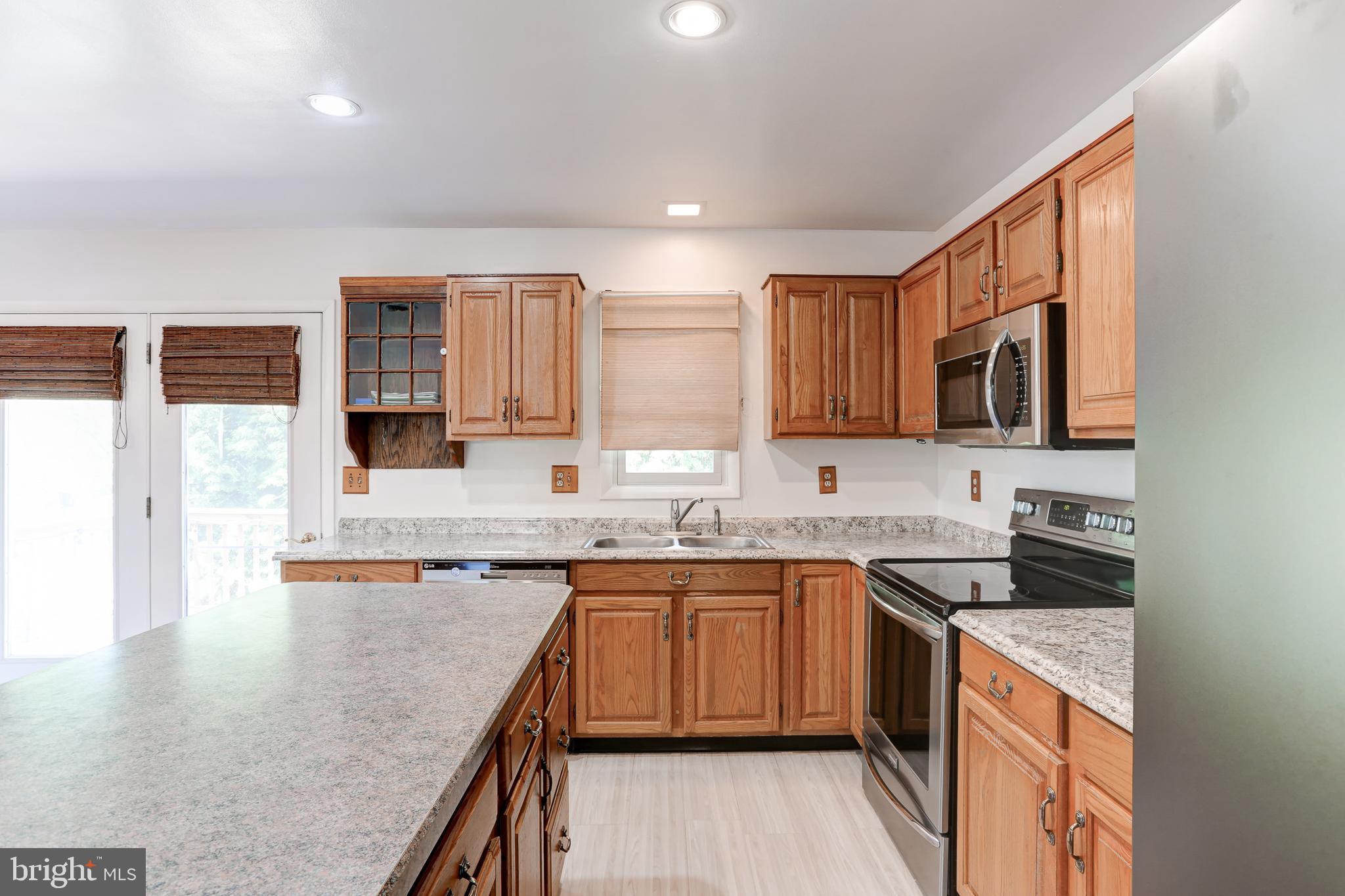 447 West Ridge Road Elizabethtown, PA 17022 - Photo 6 of 28 a kitchen with stainless steel appliances granite countertop a sink stove and refrigerator