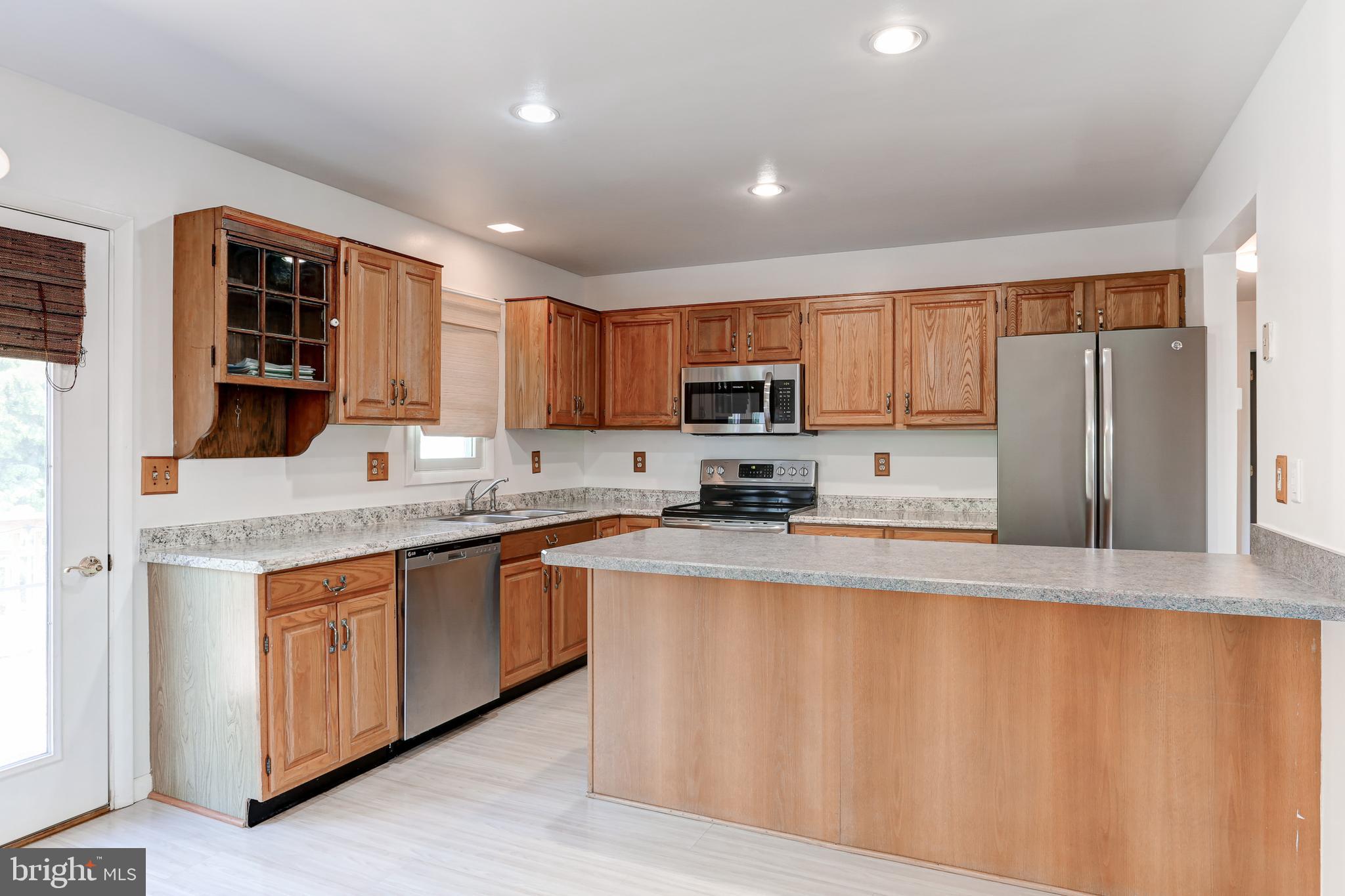 447 West Ridge Road Elizabethtown, PA 17022 - Photo 8 of 28 a large kitchen with stainless steel appliances granite countertop a stove a sink dishwasher and a refrigerator