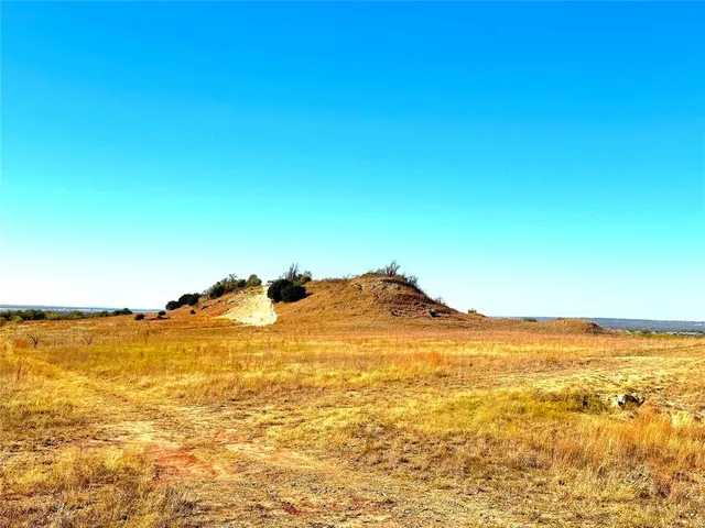 a view of a lake with houses in the back