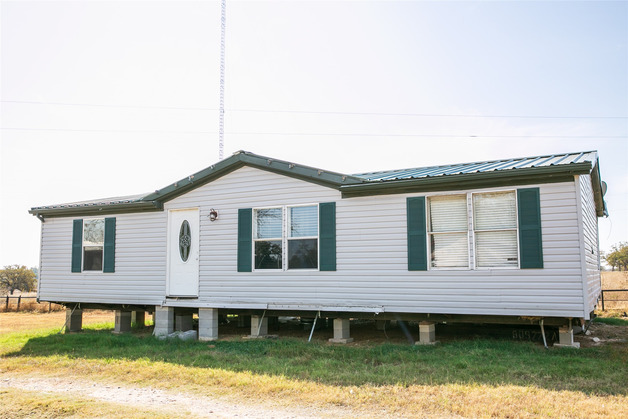 4254 FM 180 Road Ledbetter, TX 78946 - Photo 8 of 18 a front view of a house with garden