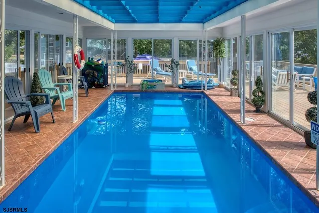 a kitchen with wooden floors and a tub