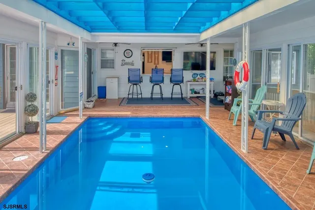 a view of a living room and dining room