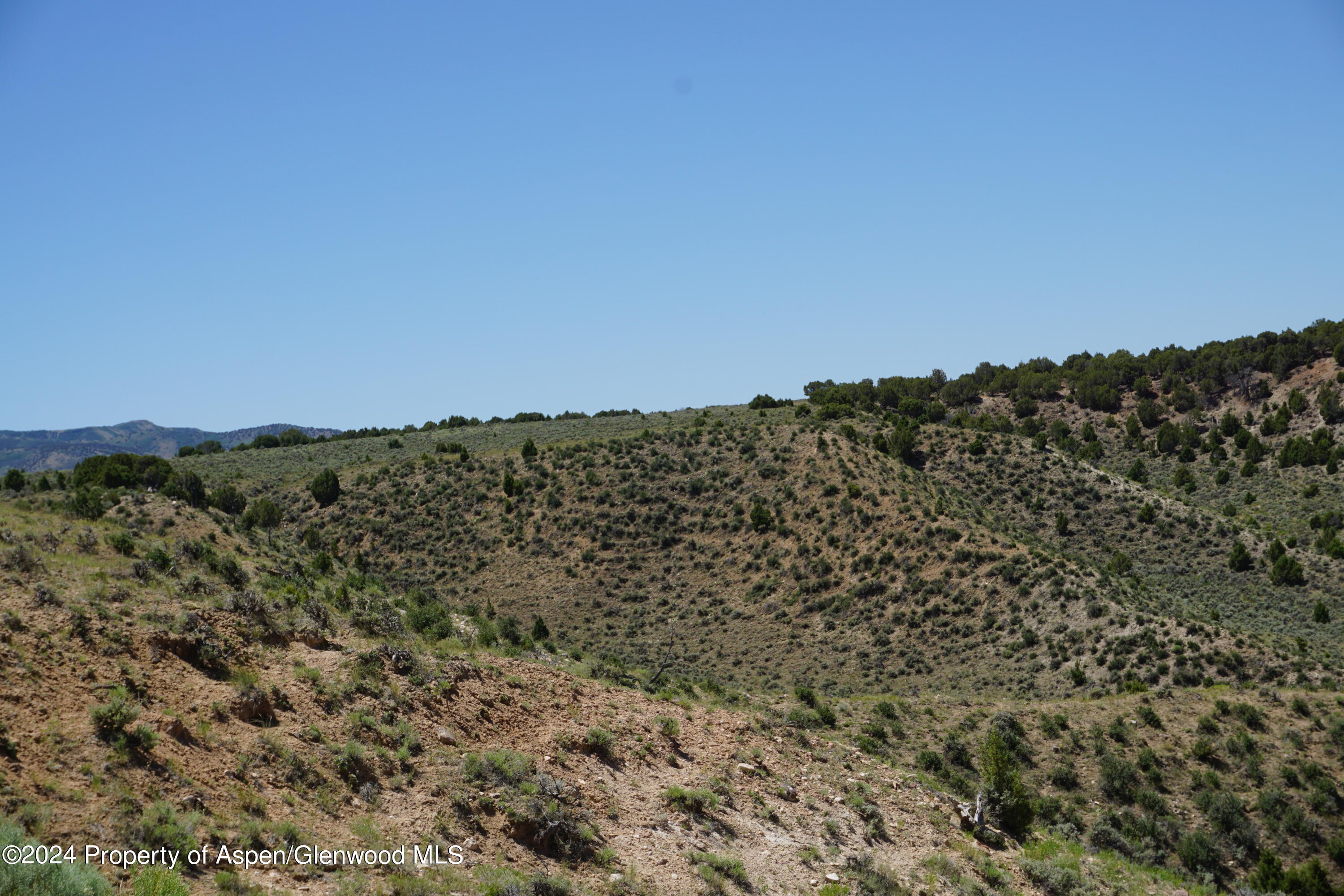 57 Maybell Co 81640 Craig, CO 81625 - Photo 6 of 12 a view of a large building with mountains in the background