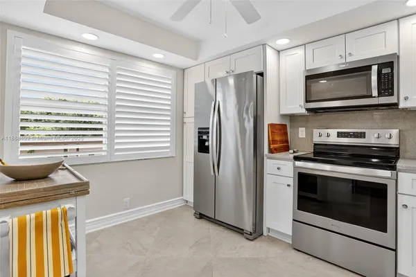 a kitchen with a stove and a microwave