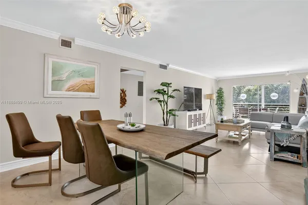 a view of a dining room with furniture window and outside view