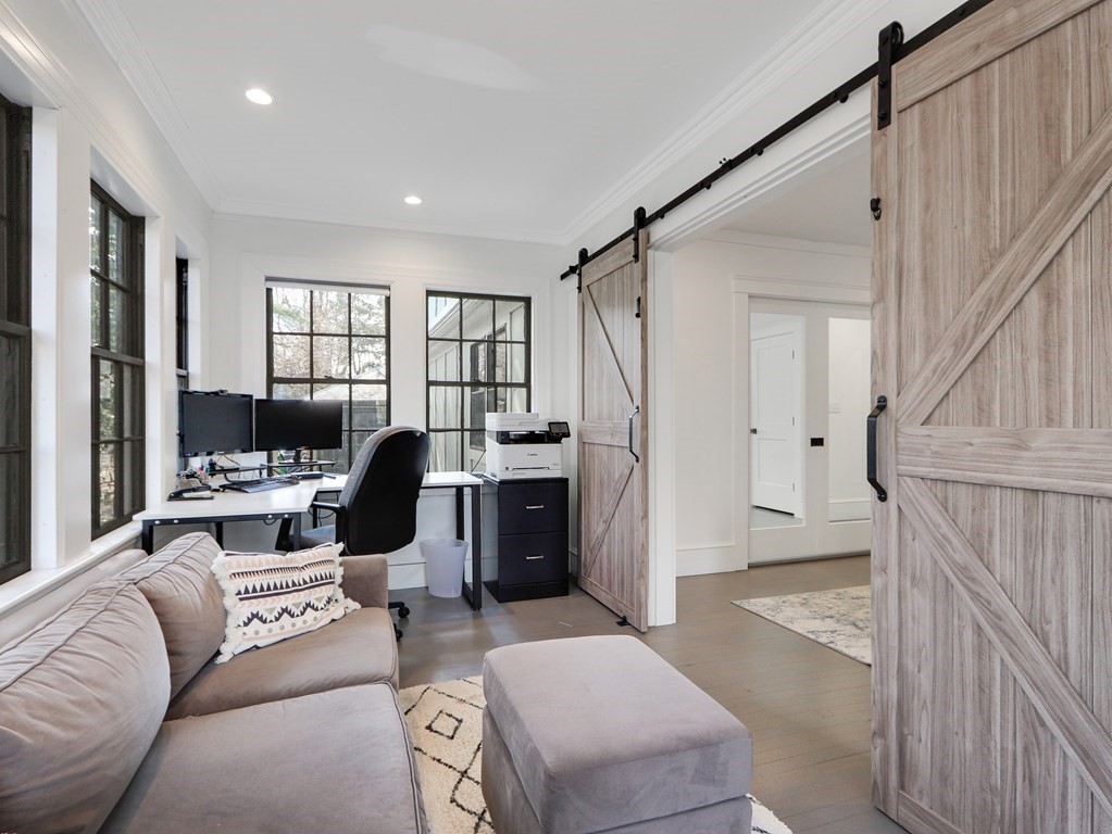 18 Brackett Road Newton, MA 02458 - Photo 12 of 32 a living room with furniture and a window