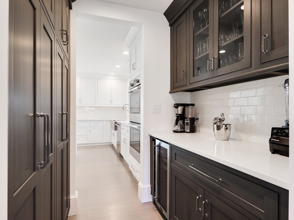 18 Brackett Road Newton, MA 02458 - Photo 15 of 32 a kitchen with stainless steel appliances a refrigerator and cabinets