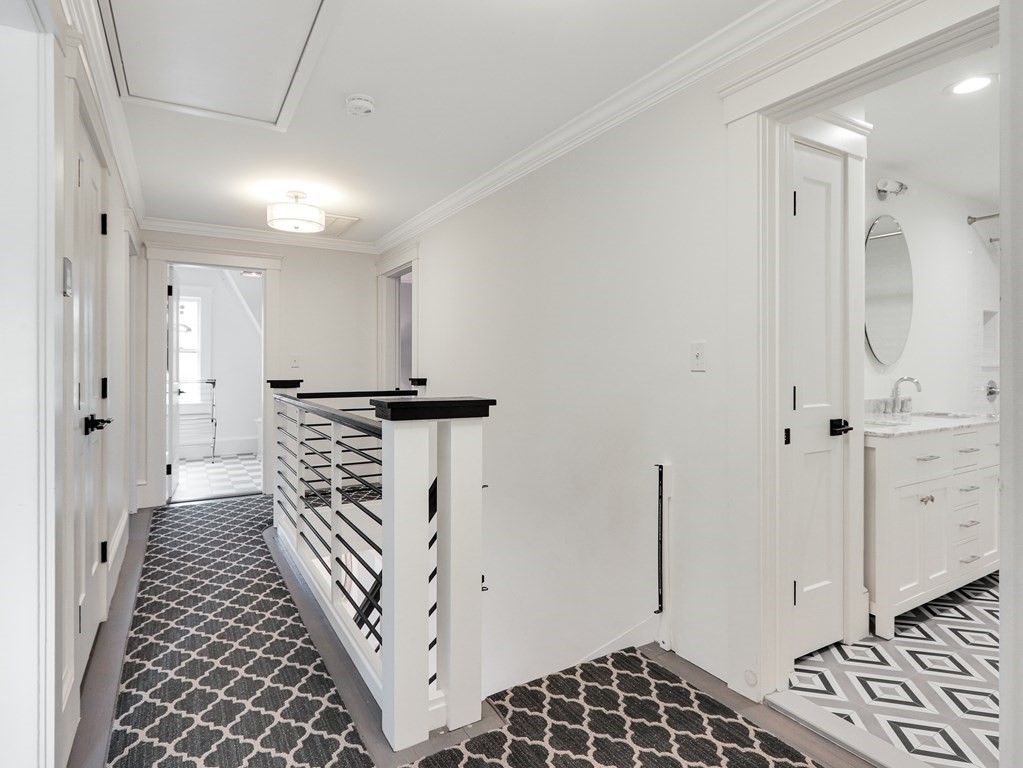 18 Brackett Road Newton, MA 02458 - Photo 16 of 32 a bathroom with a bathtub and a shower