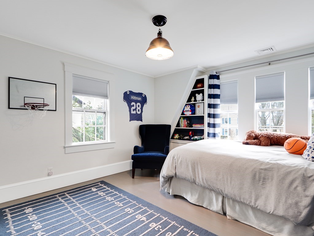 18 Brackett Road Newton, MA 02458 - Photo 21 of 32 a bedroom with a bed and a window