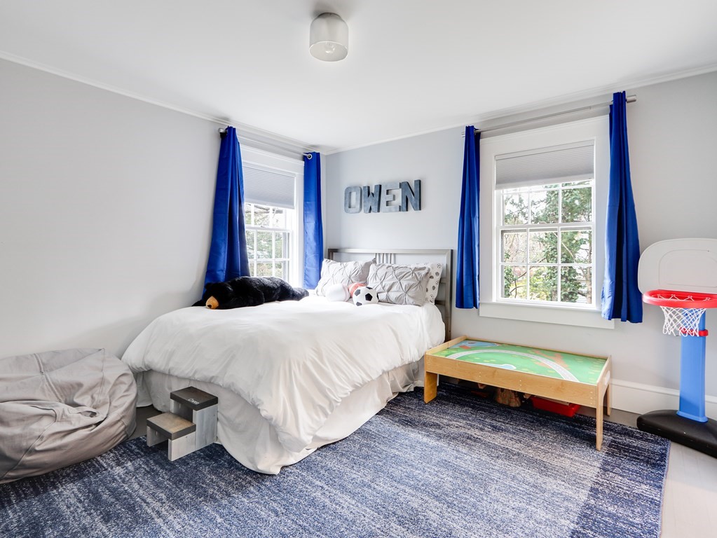 18 Brackett Road Newton, MA 02458 - Photo 23 of 32 a bedroom with a bed and a window