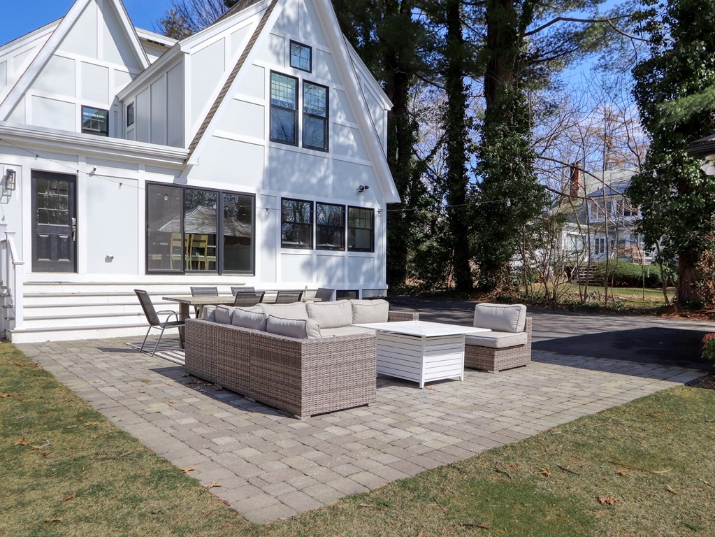 18 Brackett Road Newton, MA 02458 - Photo 30 of 32 a view of a patio with couches and a fire pit