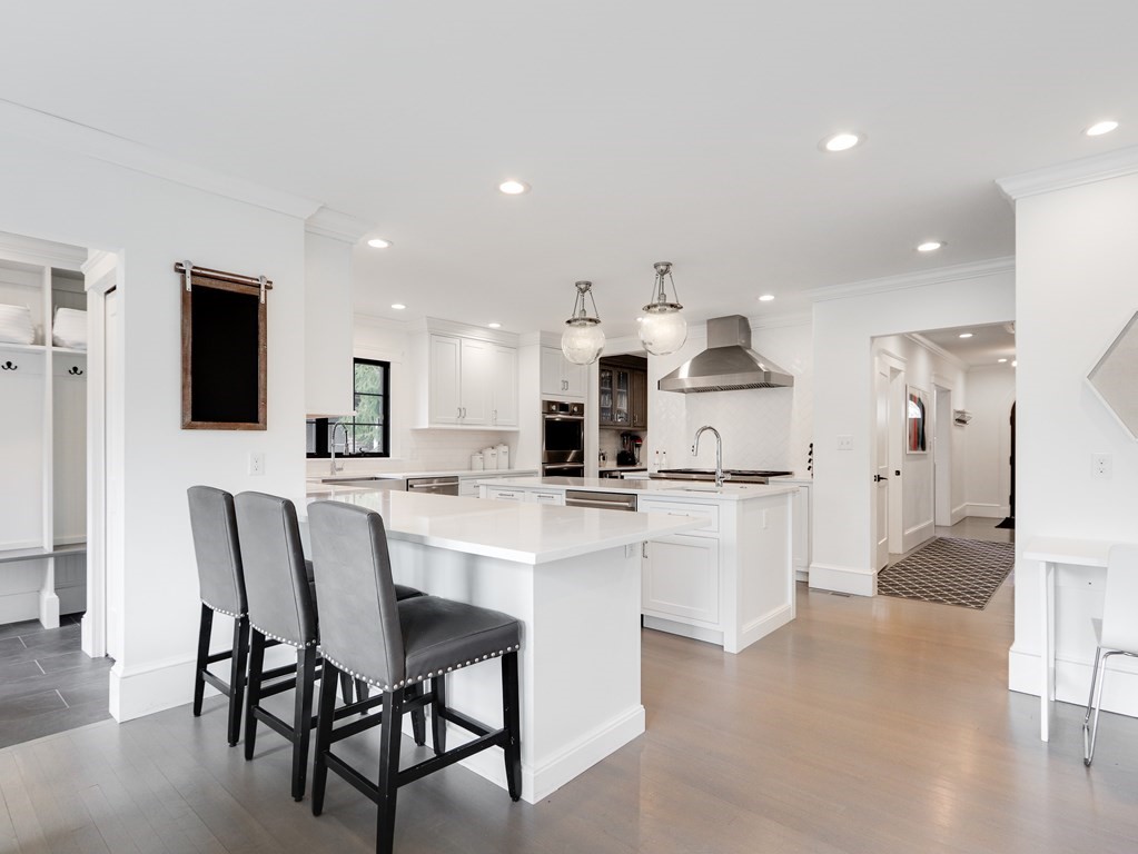 18 Brackett Road Newton, MA 02458 - Photo 4 of 32 a kitchen with a sink and chairs