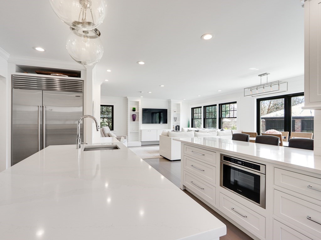 18 Brackett Road Newton, MA 02458 - Photo 6 of 32 a large white kitchen with stainless steel appliances