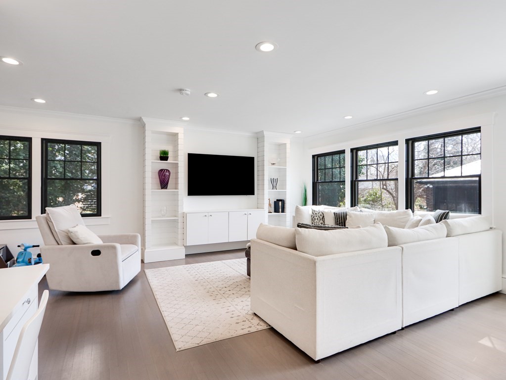 18 Brackett Road Newton, MA 02458 - Photo 7 of 32 a living room with furniture and a flat screen tv