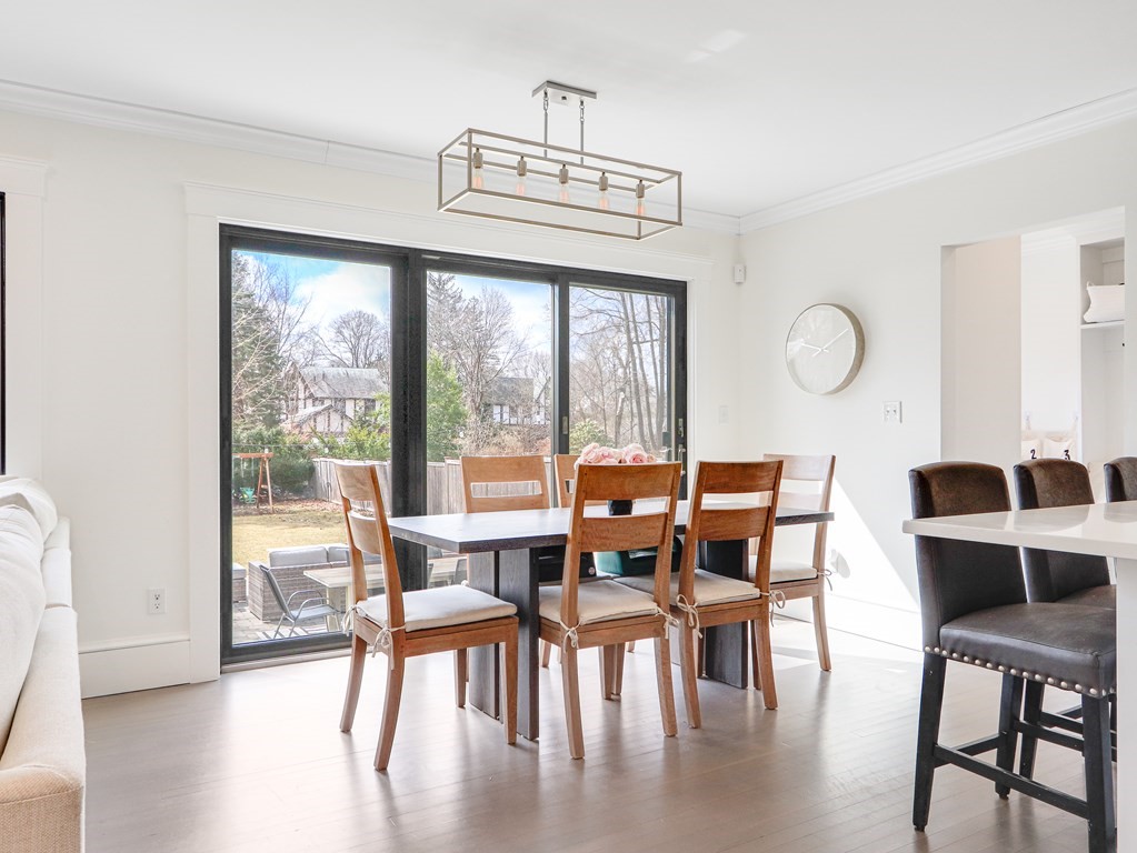 18 Brackett Road Newton, MA 02458 - Photo 9 of 32 a view of a dining room with furniture window and wooden floor