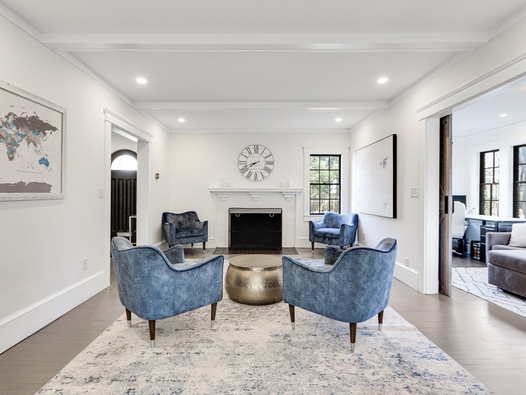 18 Brackett Road Newton, MA 02458 - Photo 10 of 32 a living room with furniture and a fireplace
