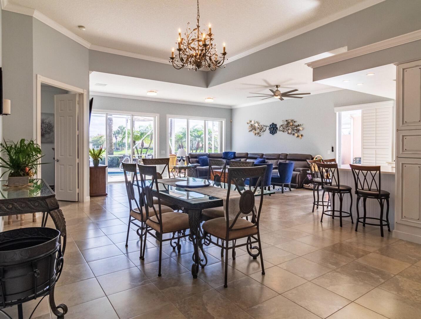 11355 Southwest Rockingham Drive Port St. Lucie, FL 34987 - Photo 11 of 31 a view of a dining room with furniture window and wooden floor