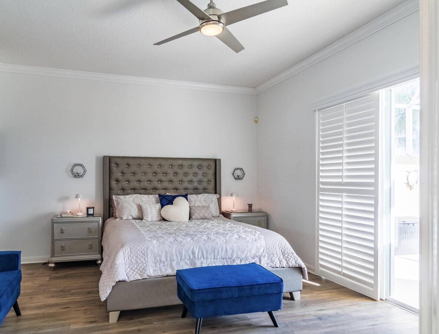 11355 Southwest Rockingham Drive Port St. Lucie, FL 34987 - Photo 12 of 31 a bedroom with a bed and wooden floor