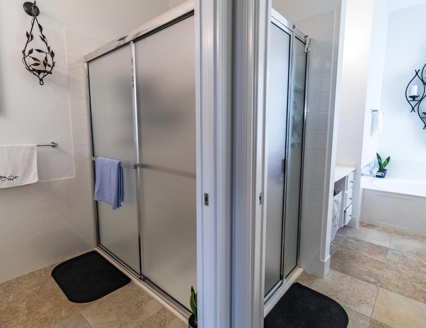 11355 Southwest Rockingham Drive Port St. Lucie, FL 34987 - Photo 15 of 31 a bathroom with a shower and a sink