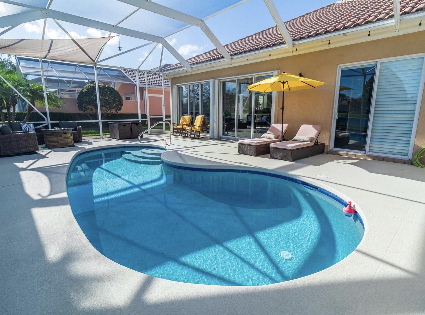 11355 Southwest Rockingham Drive Port St. Lucie, FL 34987 - Photo 23 of 31 a view of a swimming pool with sitting area
