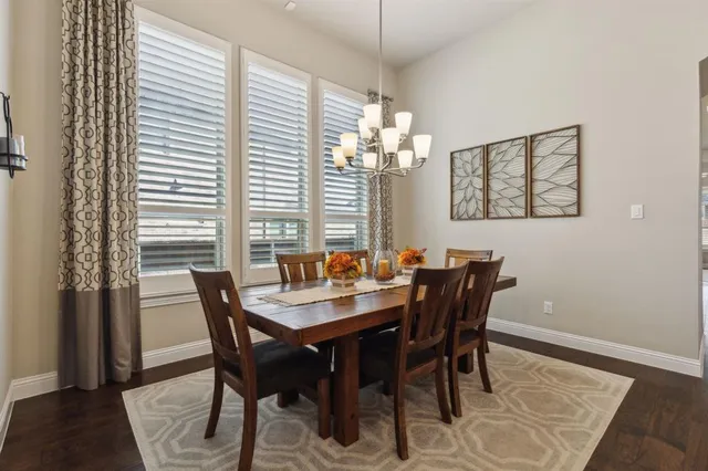 a view of a dining room with furniture and window