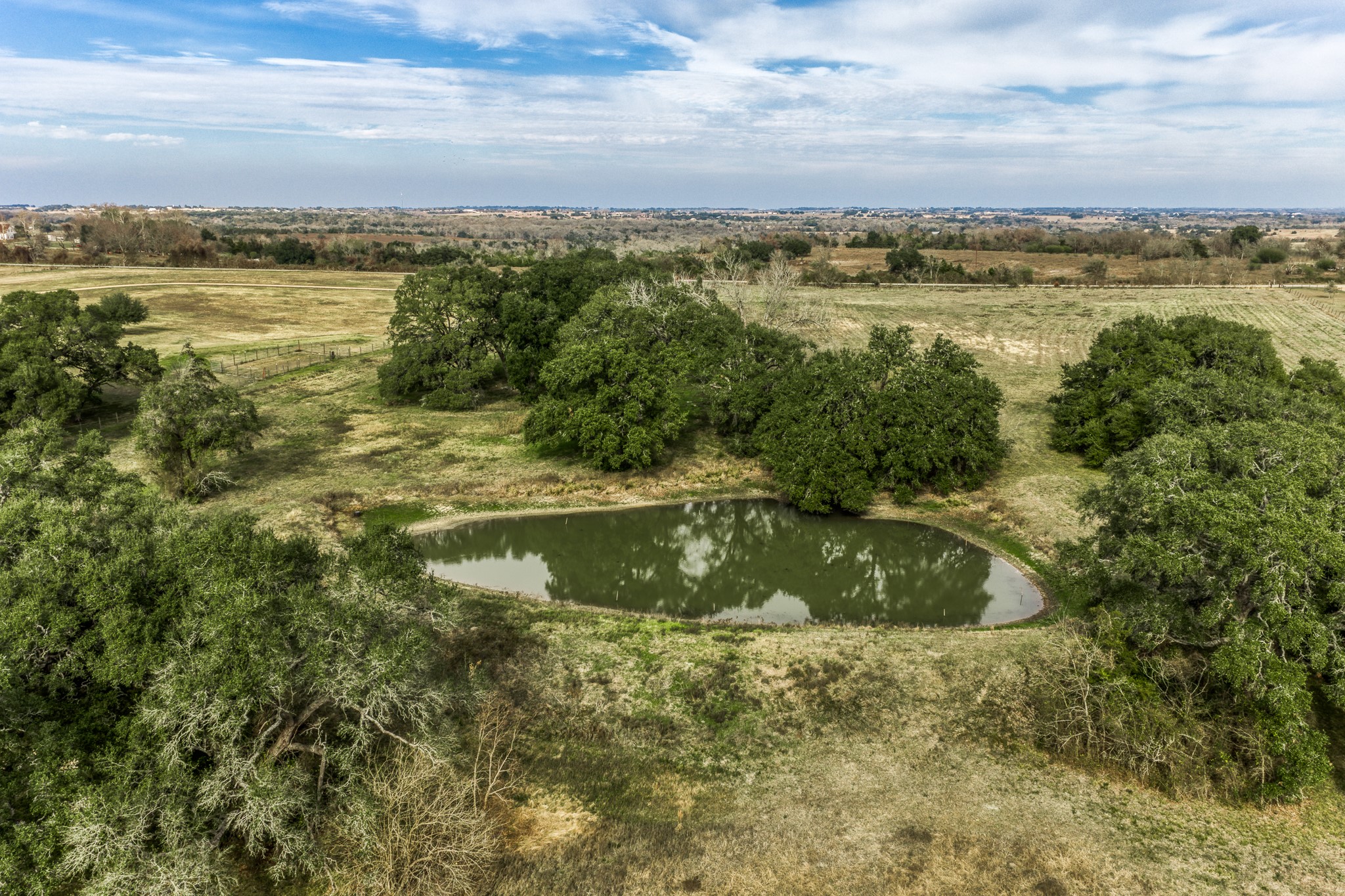 a view of lake with green space
