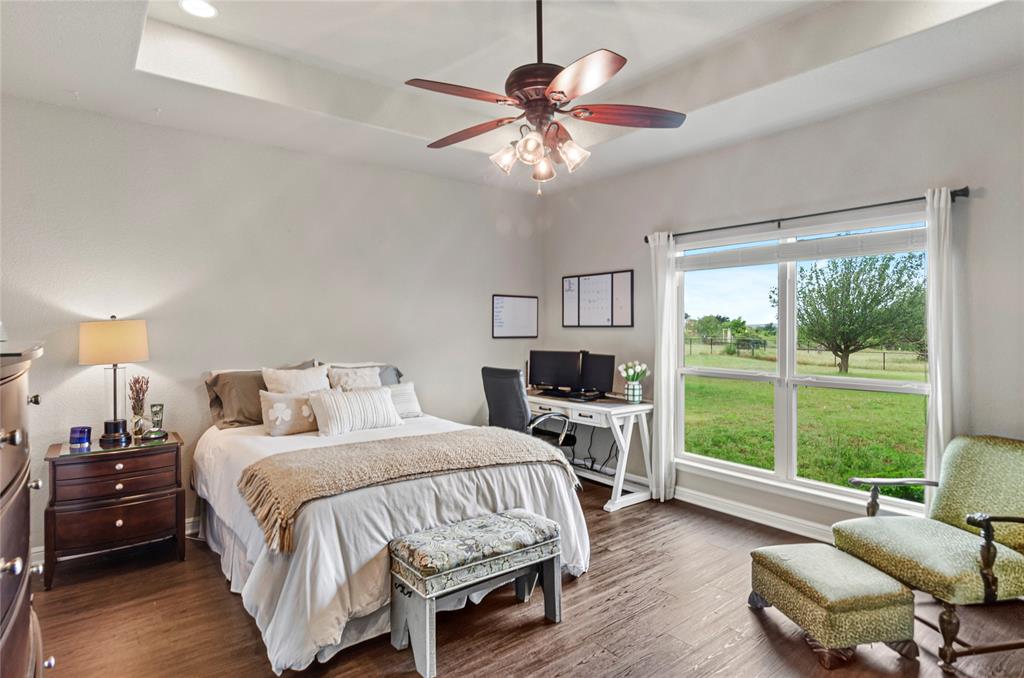 6093 Farm To Market Road 730 North Decatur, TX 76234 - Photo 10 of 28 a bedroom with a bed and a couch