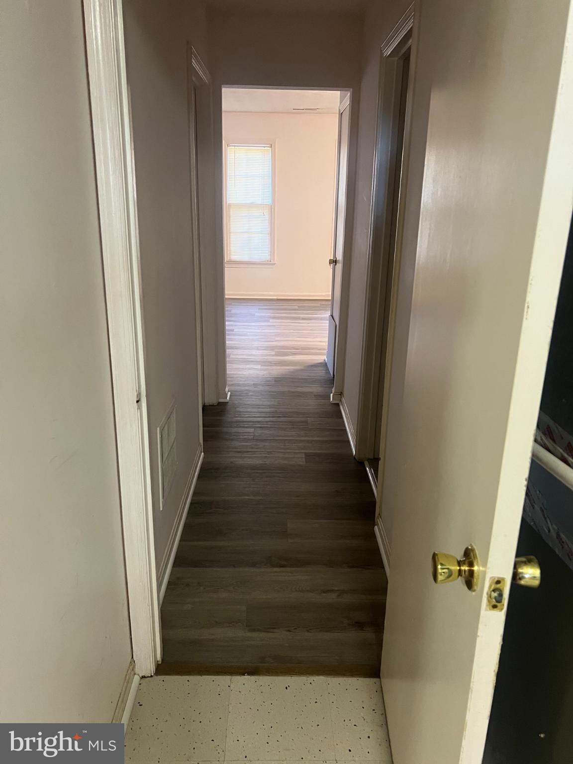215 Summit Hall Road Gaithersburg, MD 20877 - Photo 16 of 20 a view of a hallway with wooden floor and staircase