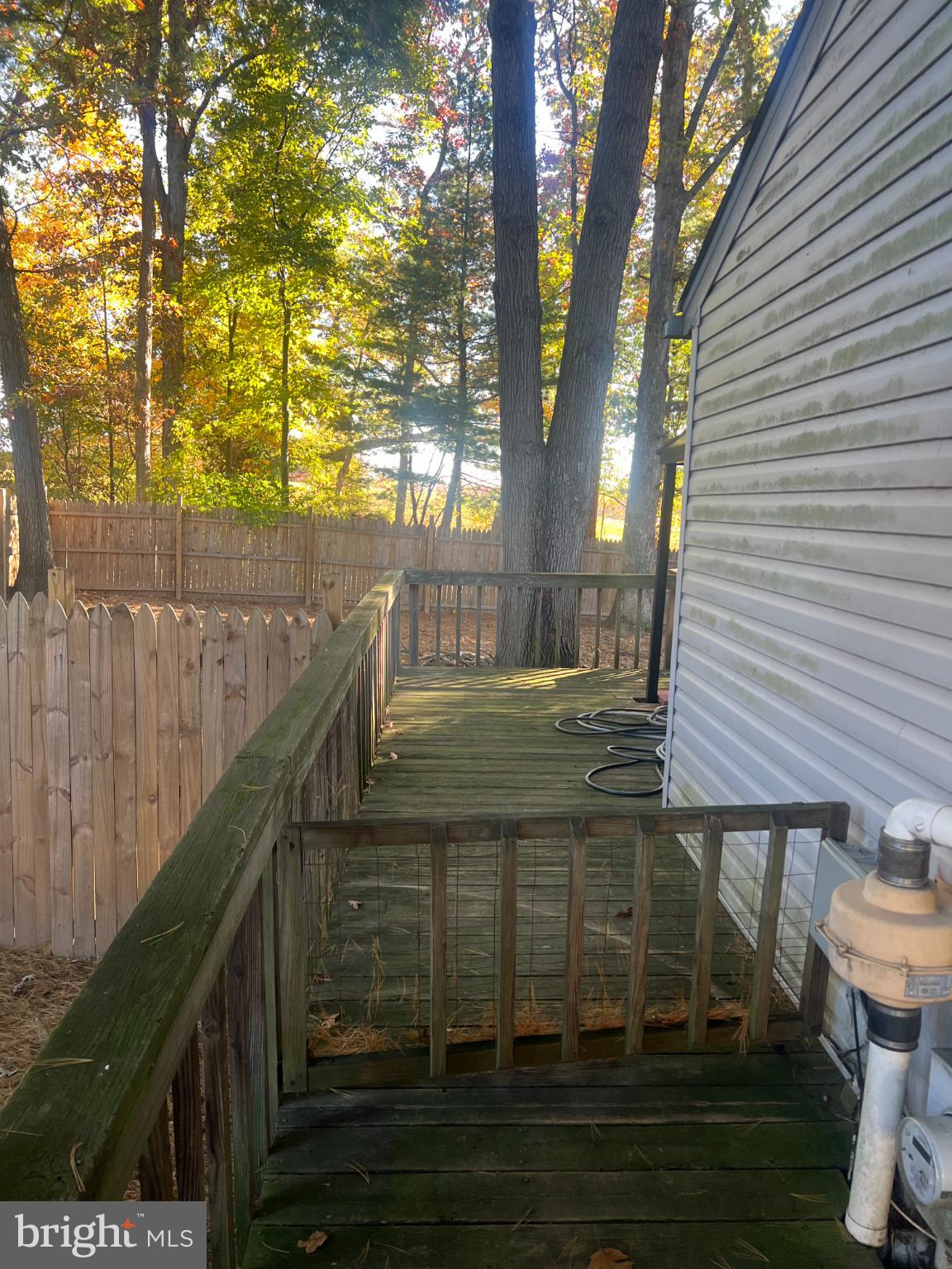 215 Summit Hall Road Gaithersburg, MD 20877 - Photo 5 of 20 a view of a backyard with sitting area and garden