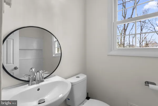 a bathroom with a sink and mirror