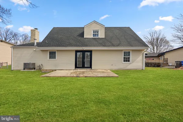 a backyard of apartments with large trees