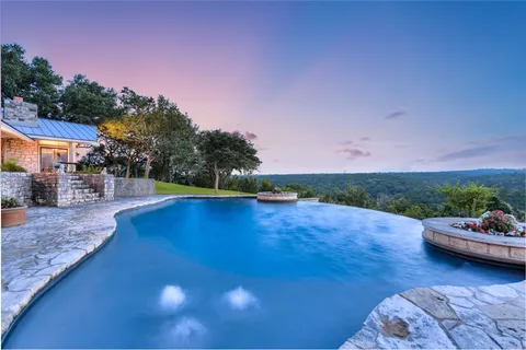 a view of a swimming pool with lounge chair