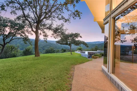 a view of a patio with a backyard