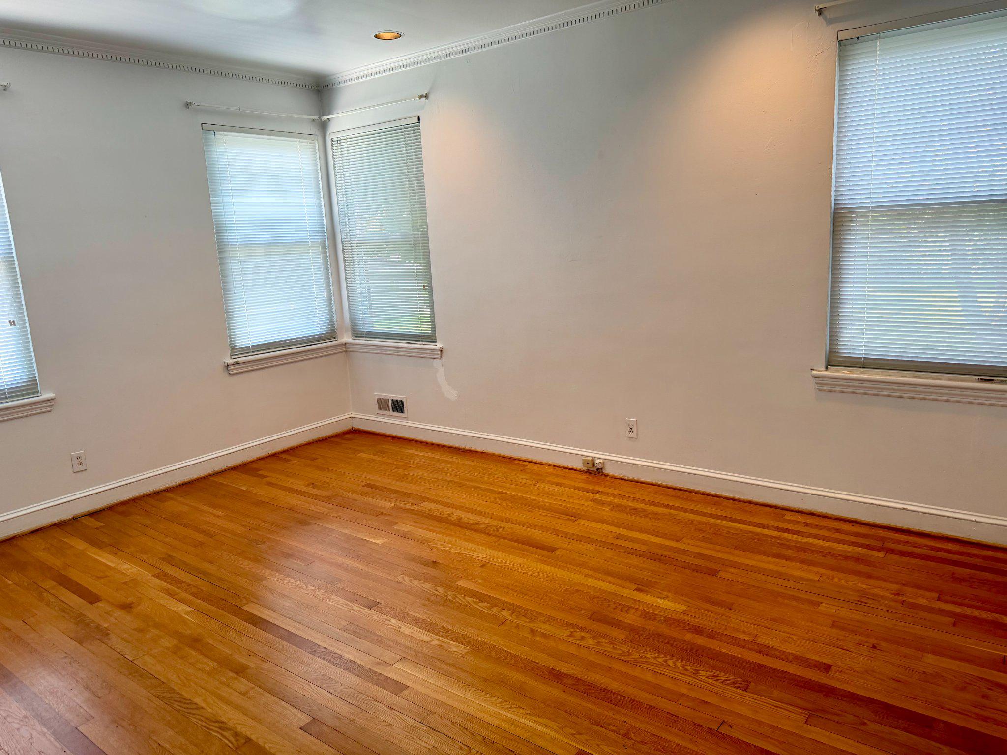 6318 Winner Avenue Baltimore, MD 21215 - Photo 35 of 75 a view of empty room with wooden floor and fan