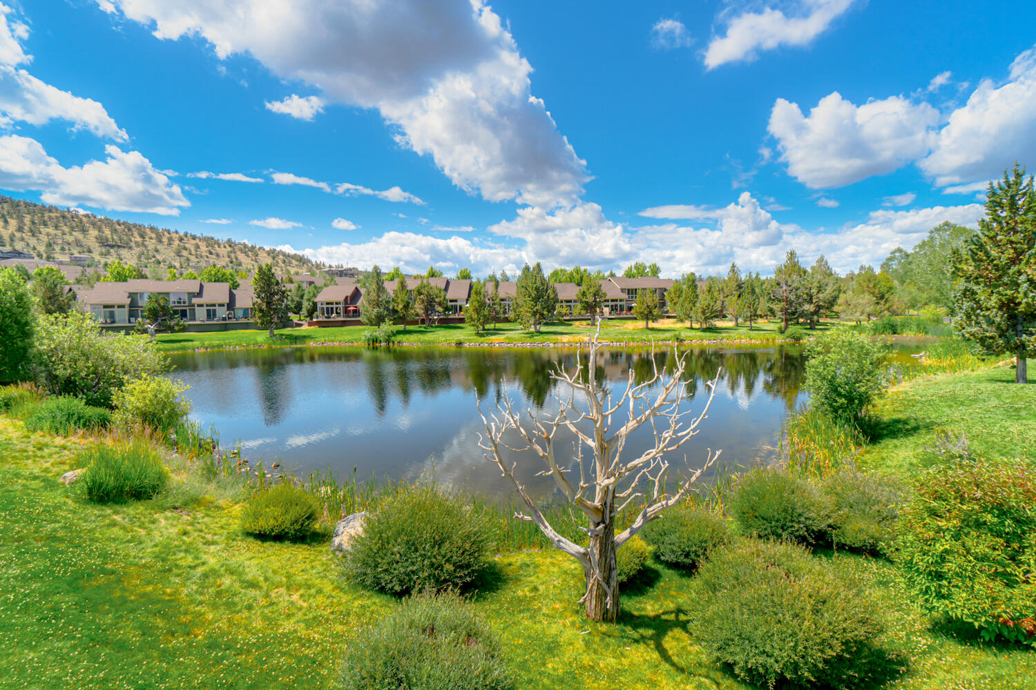 1378 Highland View Loop Redmond, OR 97756 - Photo 64 of 98 a view of a lake with houses in the back