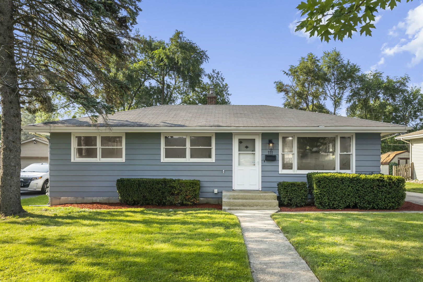 111 Wagner Drive Cary, IL 60013 - Photo 1 of 23 a front view of a house with a yard