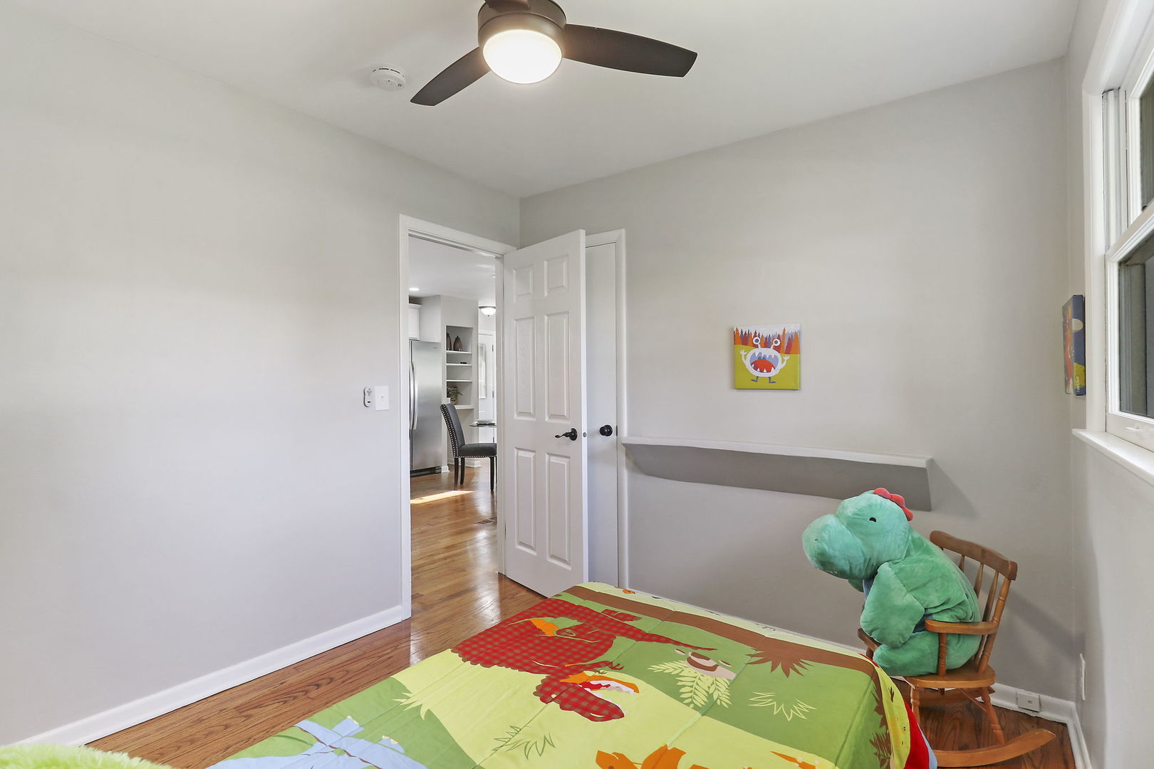 111 Wagner Drive Cary, IL 60013 - Photo 12 of 23 a bedroom with a bed and a potted plant