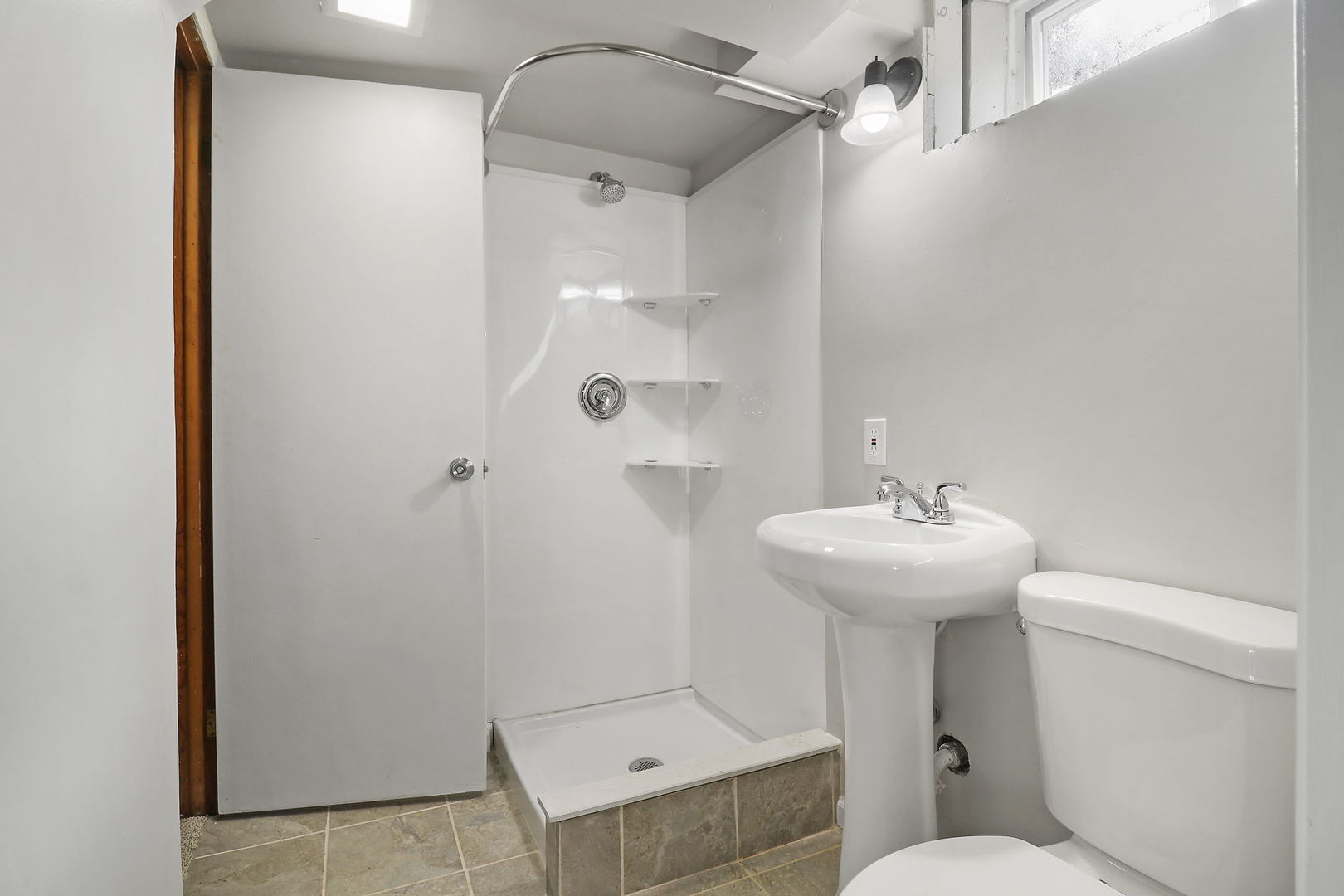 111 Wagner Drive Cary, IL 60013 - Photo 18 of 23 a bathroom with a sink a toilet and shower