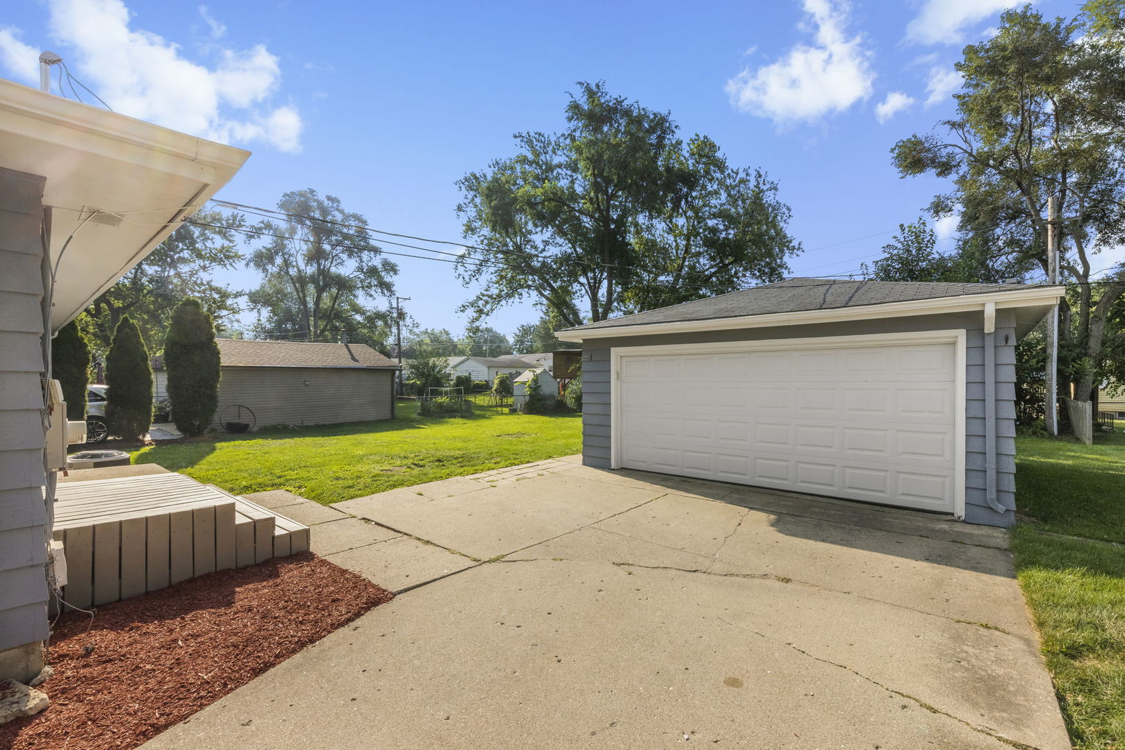 111 Wagner Drive Cary, IL 60013 - Photo 19 of 23 a view of backyard with yellow house