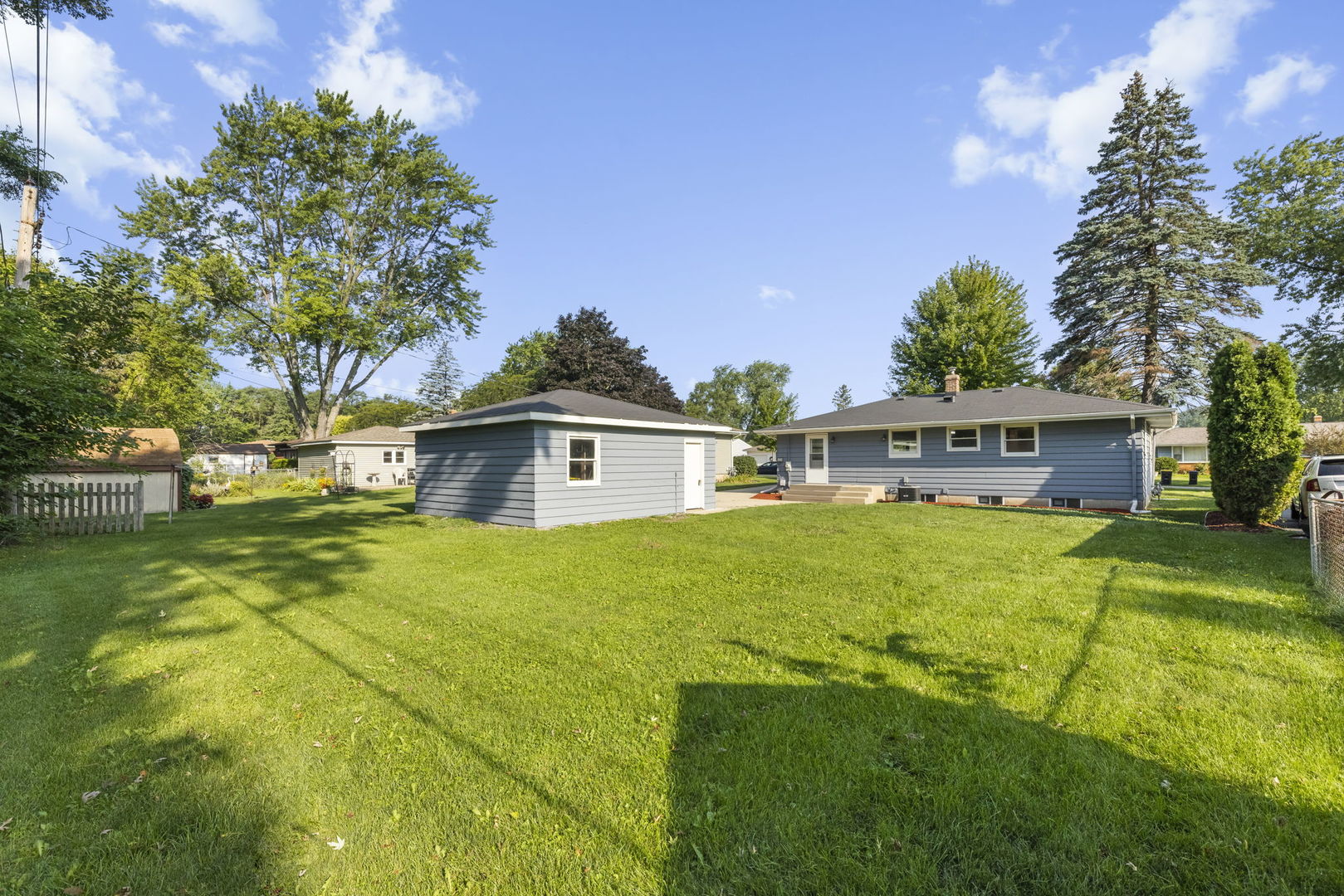 111 Wagner Drive Cary, IL 60013 - Photo 21 of 23 a front view of house with yard and trees