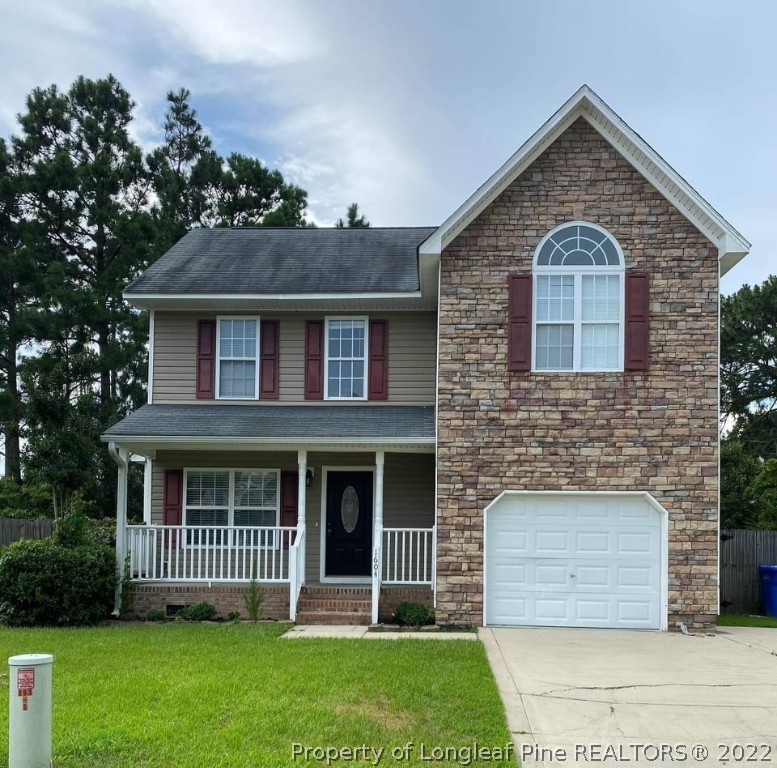 1604 Silver Ridge Court Fayetteville, NC 28304 - Photo 1 of 2 a front view of a house with a yard