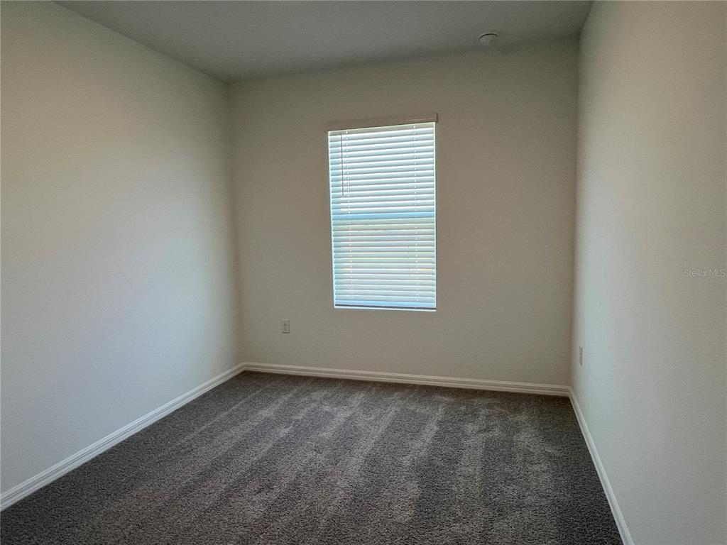 2472 Riversong Ldg Lane Wesley Chapel, FL 33543 - Photo 15 of 24 an empty room with a window