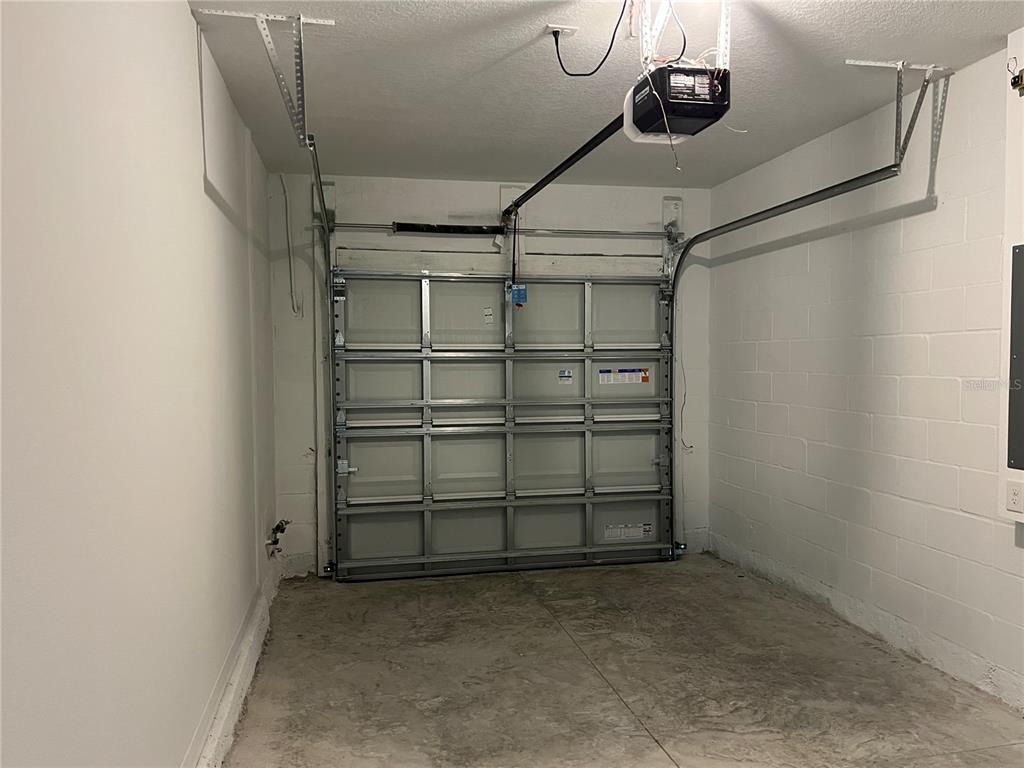 2472 Riversong Ldg Lane Wesley Chapel, FL 33543 - Photo 22 of 24 a view of a room with racks on the wall