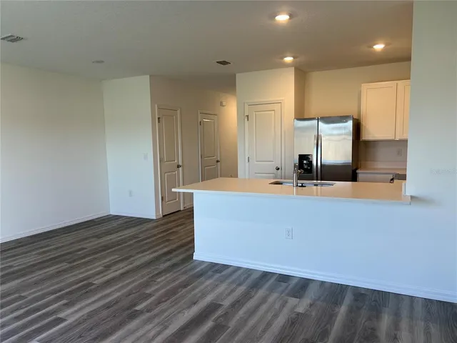 a view of kitchen with wooden floor