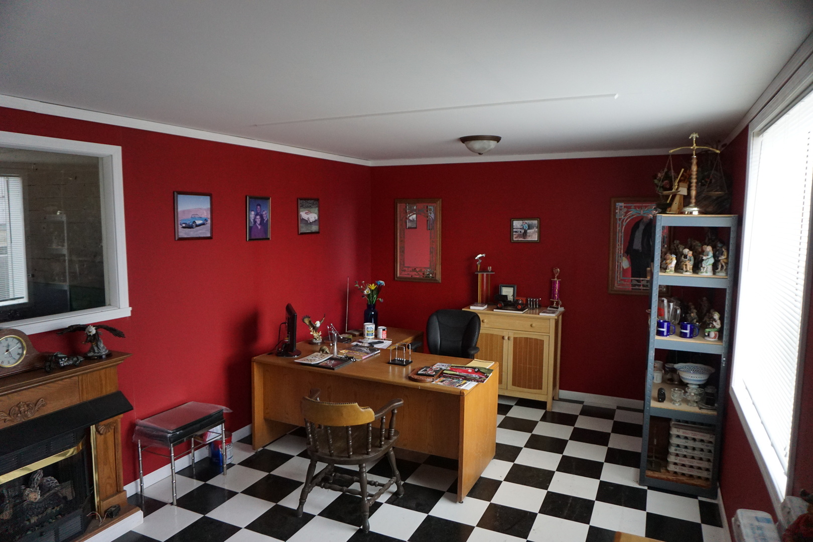 110 South Front Street Danforth, IL 60930 - Photo 8 of 13 a room with a black white checkered floor with a gaming machine and dining chairs