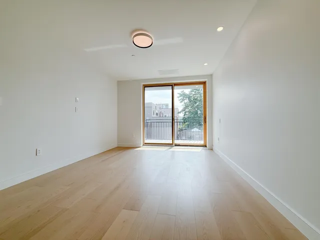 a view of a kitchen with a stove cabinets and wooden floor