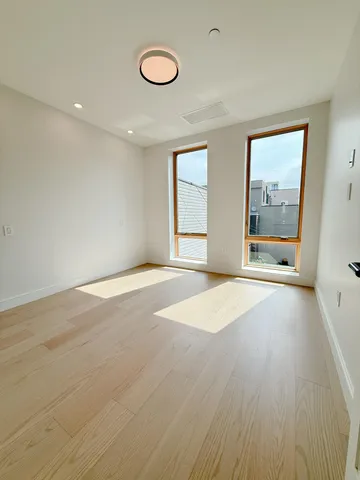a view of balcony with wooden floor