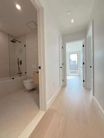 an empty room with windows and entrance