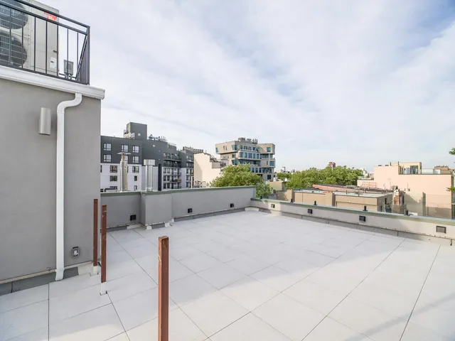 a front view of a multi story residential apartment building