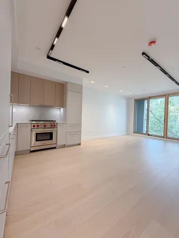 a picture of a wall with a white wall and a white refrigerator